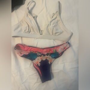 White swimsuit top and blue swimsuit botttoms